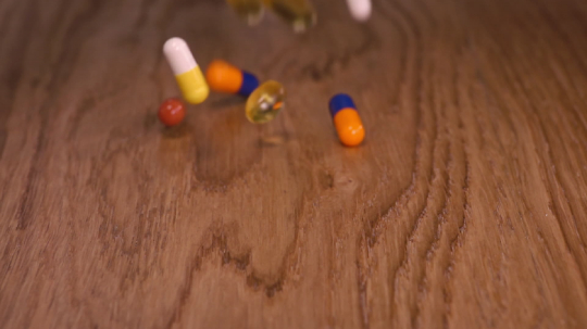 medical pills and coloured capsules falling down - authentic slow motion close up. Medical concept video  : Stock Photo or Stock Video Download rcfotostock photos, images and assets rcfotostock | RC-Photo-Stock.: