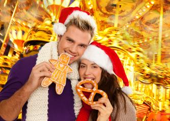 A festive couple in Santa hats enjoying gingerbread and pretzels at a vibrant Christmas market with colorful carousel lights and holiday cheer in the background
 : Stock Photo or Stock Video Download rcfotostock photos, images and assets rcfotostock | RC Photo Stock.: