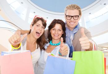 A group of cheerful friends holding colorful shopping bags, giving thumbs up inside a modern shopping mall, showcasing happiness, excitement, and successful shopping : Stock Photo or Stock Video Download rcfotostock photos, images and assets rcfotostock | RC Photo Stock.: