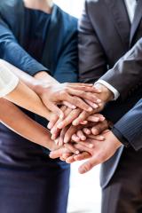 A group of diverse hands stacked together symbolizing teamwork, collaboration, unity, and support, with people dressed in business attire, emphasizing cooperation in a professional setting : Stock Photo or Stock Video Download rcfotostock photos, images and assets rcfotostock | RC Photo Stock.: