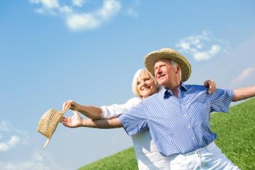 A joyful senior couple embracing outdoors in a sunny field with clear blue skies, wearing straw hats, celebrating life, and enjoying their golden years together in nature : Stock Photo or Stock Video Download rcfotostock photos, images and assets rcfotostock | RC Photo Stock.: