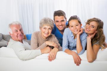 A multi-generational family portrait featuring grandparents, parents, and children bonding together on a couch, expressing warmth, connection, and joy in a bright indoor setting : Stock Photo or Stock Video Download rcfotostock photos, images and assets rcfotostock | RC Photo Stock.: