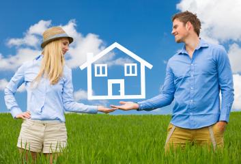 A young couple standing in a green field, holding a symbolic house icon between them, representing real estate, home ownership, or future plans under a bright blue sky with fluffy clouds : Stock Photo or Stock Video Download rcfotostock photos, images and assets rcfotostock | RC Photo Stock.: