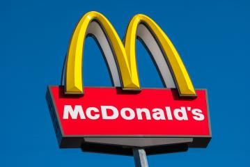 AAACHEN, GERMANY JANUARY, 2017: Closeup of the McDonald's restauraunt sign in germany. The McDonald's Corporation is the world's largest chain of hamburger fast food restaurants.- Stock Photo or Stock Video of rcfotostock | RC Photo Stock