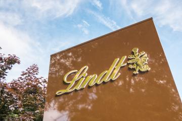 AACHEN, GERMANY APRIL, 2017: Lindt company logo. Lindt is a brand of the Lindt & Sprungli AG - a Swiss company, founded in 1845.- Stock Photo or Stock Video of rcfotostock | RC Photo Stock