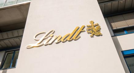 AACHEN, GERMANY APRIL, 2017: Lindt logo on a wall. Lindt is a brand of the Lindt & Sprungli AG - a Swiss company, founded in 1845.- Stock Photo or Stock Video of rcfotostock | RC-Photo-Stock