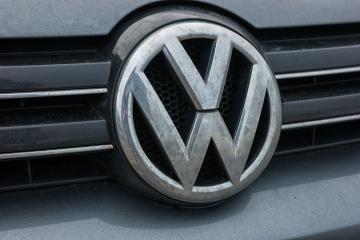 AACHEN, GERMANY FEBRUARY, 2017: Dirty Volkswagen VW plate logo on a car grilll. Volkswagen is a famous European car manufacturer company based on Germany.- Stock Photo or Stock Video of rcfotostock | RC Photo Stock