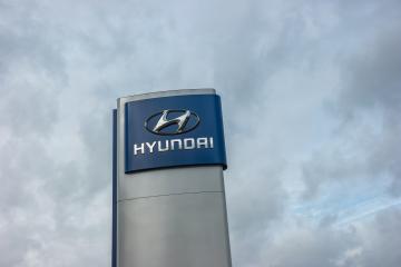 AACHEN, GERMANY FEBRUARY, 2017: Logotype of Hyundai corporation over cloudy Sky.  Hyundai is the South Korea's automotive manufacturer.- Stock Photo or Stock Video of rcfotostock | RC-Photo-Stock