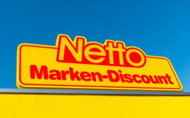 AACHEN, GERMANY FEBRUARY, 2017: Netto discount store Logo against blue sky. It is part of Edeka Group, largest German supermarket corporation employing 250,000 people. : Stock Photo or Stock Video Download rcfotostock photos, images and assets rcfotostock | RC Photo Stock.: