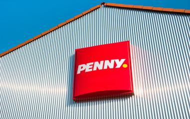 AACHEN, GERMANY FEBRUARY, 2017: Penny sign. Penny is, a discount supermarket chain based in Germany, which operates 3,550 stores in Europe. Penny market is owned by the German Rewe Group.- Stock Photo or Stock Video of rcfotostock | RC-Photo-Stock