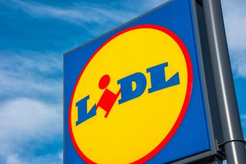 AACHEN, GERMANY JANUARY, 2017: LIDL supermarket chain sign against the blue cloudy sky. LIDL is a German global discount supermarket chain, based in Neckarsulm, Baden-Wuerttemberg, Germany.- Stock Photo or Stock Video of rcfotostock | RC Photo Stock