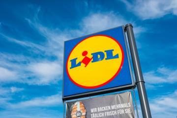 AACHEN, GERMANY JANUARY, 2017: LIDL supermarket chain sign against the blue cloudy sky. LIDL is a German global discount supermarket chain, based in Neckarsulm, Baden-Wuerttemberg, Germany.- Stock Photo or Stock Video of rcfotostock | RC Photo Stock