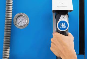 Aachen, Germany, January 2021: Female hold a fuel dispenser with hydrogen on gas station. h2 combustion engine for emission free eco friendly transport.- Stock Photo or Stock Video of rcfotostock | RC Photo Stock