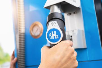 Aachen, Germany, January 2021: Man hold a fuel dispenser with hydrogen on gas station. h2 combustion engine for emission free eco friendly transport.- Stock Photo or Stock Video of rcfotostock | RC Photo Stock