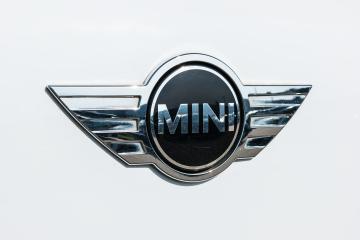 AACHEN, GERMANY MARCH, 2017: Mini cooper car logo on white car. It is a model produced by BMW since 2000. BMW is a German luxury vehicle, motorcycle, and engine manufacturing company founded in 1916.- Stock Photo or Stock Video of rcfotostock | RC-Photo-Stock