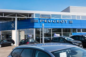 AACHEN, GERMANY MARCH, 2017: Office of official Peugeot dealer. Peugeot is a French automobile manufacturer and part of Groupe PSA.- Stock Photo or Stock Video of rcfotostock | RC Photo Stock