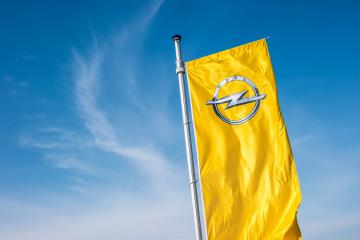 AACHEN, GERMANY MARCH, 2017: Opel flag against blue sky at the Opel Store. Opel AG is a German automobile manufacturer.- Stock Photo or Stock Video of rcfotostock | RC-Photo-Stock