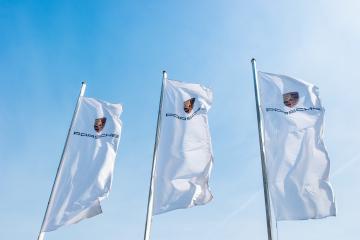AACHEN, GERMANY MARCH, 2017: Porsche Sign on a flags against blue sky. Ferdinand Porsche founded the company in 1931 with main offices in the centre of Stuttgart.- Stock Photo or Stock Video of rcfotostock | RC Photo Stock
