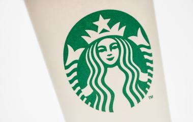 AACHEN, GERMANY OCTOBER, 2017: Logo of a Starbucks on a paper Coffee cup. Starbucks is the largest coffeehouse company in the world, Founded in Washington, 1971.- Stock Photo or Stock Video of rcfotostock | RC-Photo-Stock