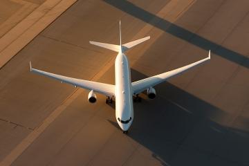 Aerial view of a commercial airplane on the tarmac at sunset
 : Stock Photo or Stock Video Download rcfotostock photos, images and assets rcfotostock | RC Photo Stock.: