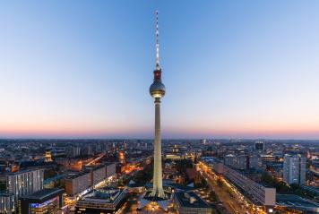 Aerial view of Berlin skyline with famous TV tower at Alexanderplatz and dramatic clouds in twilight during blue hour at dusk, Germany : Stock Photo or Stock Video Download rcfotostock photos, images and assets rcfotostock | RC Photo Stock.: