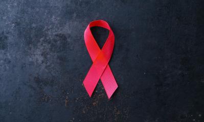 Aids Awareness. red AIDS awareness ribbon on black background. healthcare and medicine concept. copyspace for your individual text. - Stock Photo or Stock Video of rcfotostock | RC-Photo-Stock