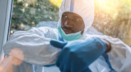 American Doctor with protective clothing in stress with burnout in clinic because of Covid-19 and coronavirus epidemic- Stock Photo or Stock Video of rcfotostock | RC-Photo-Stock
