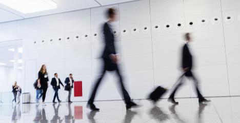 Anonymous blurred business people rush through trade fair hall or airport- Stock Photo or Stock Video of rcfotostock | RC Photo Stock