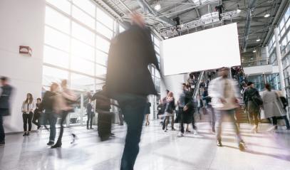 Anonymous blurred business people walking in a hall of a Exhibition- Stock Photo or Stock Video of rcfotostock | RC Photo Stock