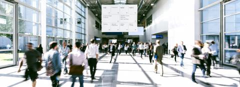 Anonymous blurred people walking in a hall of a Exhibition- Stock Photo or Stock Video of rcfotostock | RC Photo Stock