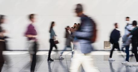 Anonymous group of people in the hallway of a hall at a business trade fair- Stock Photo or Stock Video of rcfotostock | RC Photo Stock
