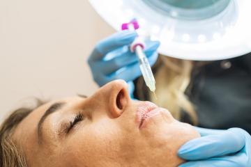 Anti-aging face treatment. Close up portrait of woman having botox rejuvenation procedure of lip zone by specialist- Stock Photo or Stock Video of rcfotostock | RC Photo Stock
