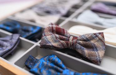 Assorted bow ties displayed in organizer, focus on plaid bow tie in foreground at a store- Stock Photo or Stock Video of rcfotostock | RC Photo Stock