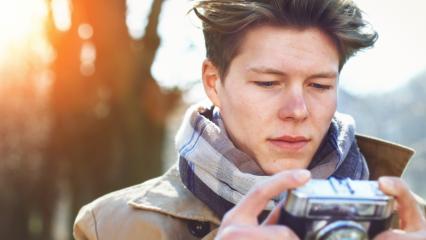 Attractive Tourist taking a photograph with vintage camera- Stock Photo or Stock Video of rcfotostock | RC-Photo-Stock