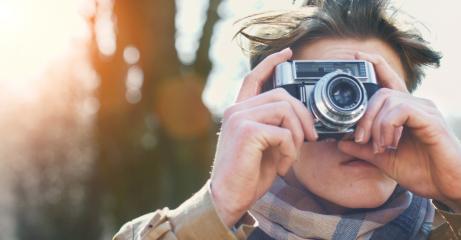 Attractive Tourist taking a photograph with vintage camera- Stock Photo or Stock Video of rcfotostock | RC-Photo-Stock