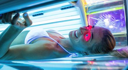 Attractive young woman tanning in solarium with glasses- Stock Photo or Stock Video of rcfotostock | RC Photo Stock