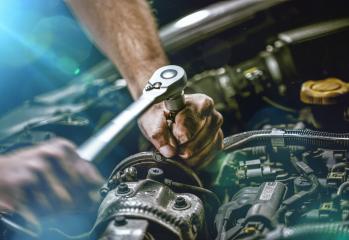 Auto mechanic working in garage. Repair service.- Stock Photo or Stock Video of rcfotostock | RC Photo Stock