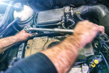 Auto mechanic working on car engine in a mechanics garage. Repair service. authentic close-up shot with motion blur : Stock Photo or Stock Video Download rcfotostock photos, images and assets rcfotostock | RC Photo Stock.:
