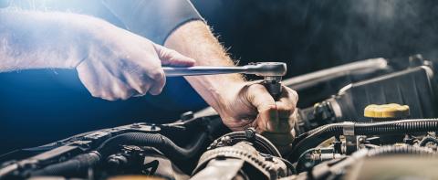 Auto mechanic working on car engine in mechanics garage. Repair service. authentic close-up shot, banner size : Stock Photo or Stock Video Download rcfotostock photos, images and assets rcfotostock | RC-Photo-Stock.: