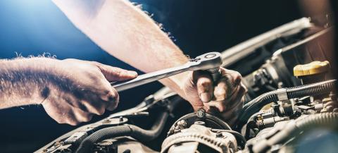 Auto mechanic working on car engine in mechanics garage. Repair service. authentic close-up shot, banner size : Stock Photo or Stock Video Download rcfotostock photos, images and assets rcfotostock | RC-Photo-Stock.: