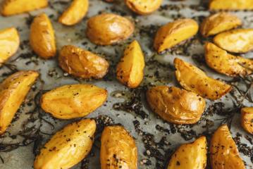 Baked potato wedges with rosemary and oil - Stock Photo or Stock Video of rcfotostock | RC-Photo-Stock
