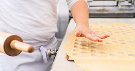 baker prepares cookie dough, cutting out heart shapes with a rolling pin nearby. The dough is arranged on a flat surface, showcasing the precision of the baking process : Stock Photo or Stock Video Download rcfotostock photos, images and assets rcfotostock | RC Photo Stock.:
