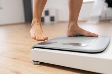 bare feet stepping onto a modern body composition scale in a fitness or medical setting during Inbody test- Stock Photo or Stock Video of rcfotostock | RC Photo Stock