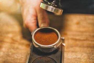 Barista with portafilter preparing coffee at cafe : Stock Photo or Stock Video Download rcfotostock photos, images and assets rcfotostock | RC Photo Stock.: