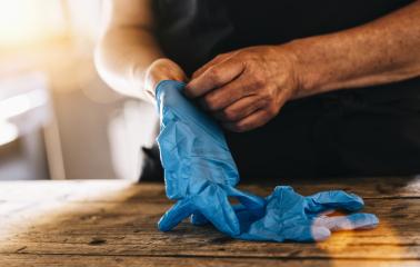 bartender or employee wearing a medical Latex gloves at work to prevent corona COVID-19 and SARS infection- Stock Photo or Stock Video of rcfotostock | RC-Photo-Stock