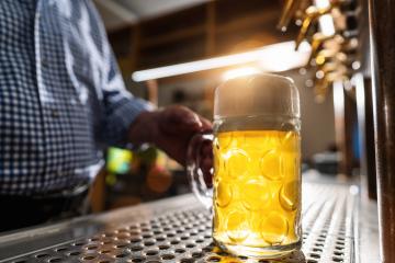 bartender serving beer in mug at Biergarten or Oktoberfest, Munich, Germany- Stock Photo or Stock Video of rcfotostock | RC Photo Stock