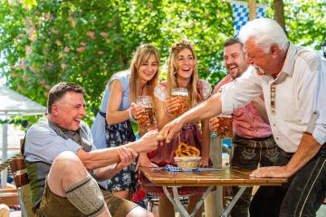 Bavarian friends practicing the high art of Fingerhakeln (German for: arm or finger wrestling) in a beer garden or oktoberfest : Stock Photo or Stock Video Download rcfotostock photos, images and assets rcfotostock | RC Photo Stock.: