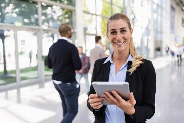 beautiful businesswoman at a trade show- Stock Photo or Stock Video of rcfotostock | RC Photo Stock
