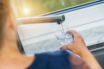Beautiful woman filling glass with water in kitchen- Stock Photo or Stock Video of rcfotostock | RC Photo Stock