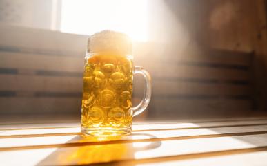 beer mug with frothy beer rest on a ledge in a finnish sauna, catching sunlight. spa and wellness concept image- Stock Photo or Stock Video of rcfotostock | RC Photo Stock